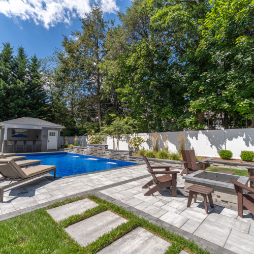 Completed pool with wide angle deck and pool side chairs